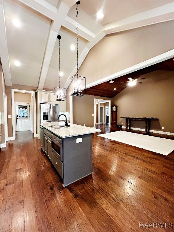 475 Mountain Meadows Ln, Wetumpka, AL 36093 - kitchen with stainless steel appliances, a sink, a kitchen island with sink, light stone countertops, and hanging light fixtures