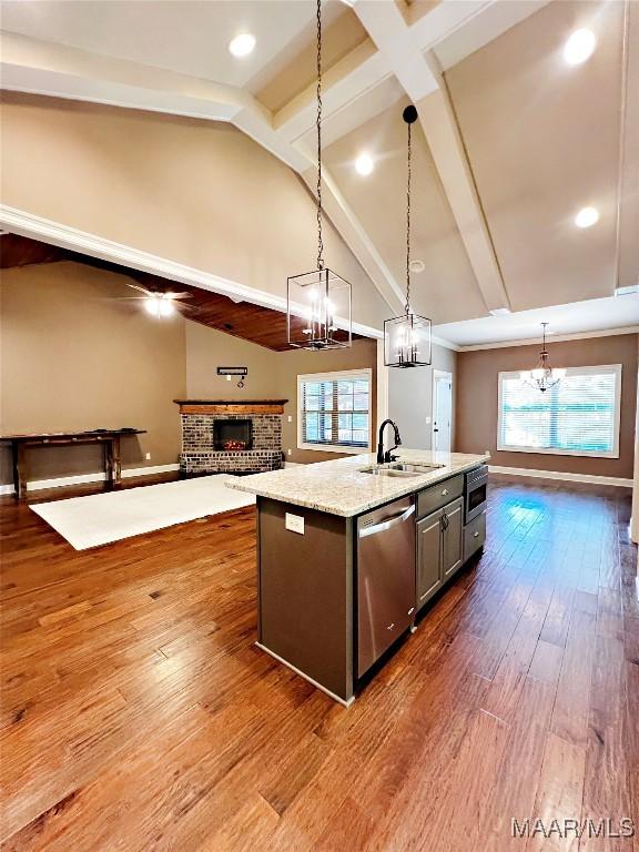 475 Mountain Meadows Ln, Wetumpka, AL 36093 - kitchen featuring a chandelier, dishwasher, a fireplace, healthy amount of natural light, and beam ceiling