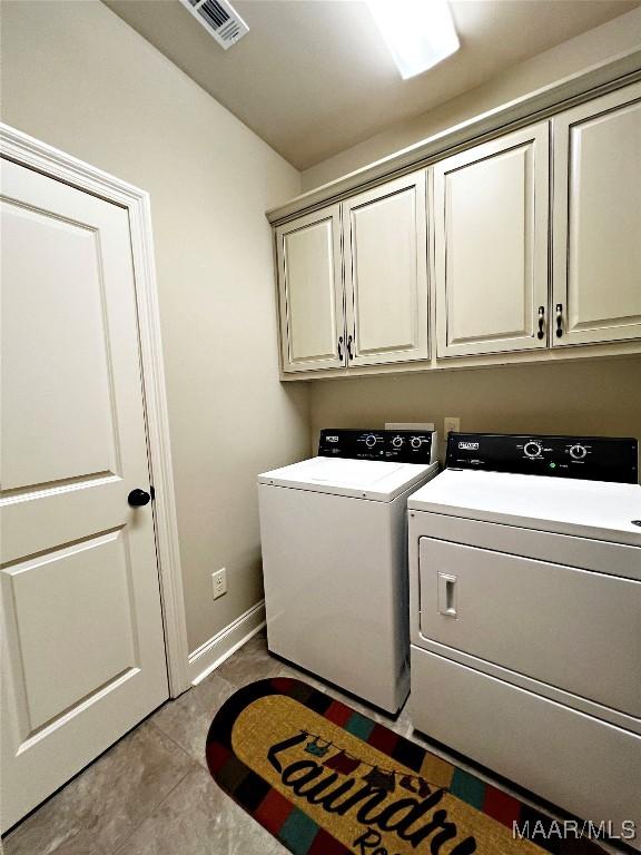 475 Mountain Meadows Ln, Wetumpka, AL 36093 - laundry room featuring cabinet space, separate washer and dryer, baseboards, and tile patterned flooring