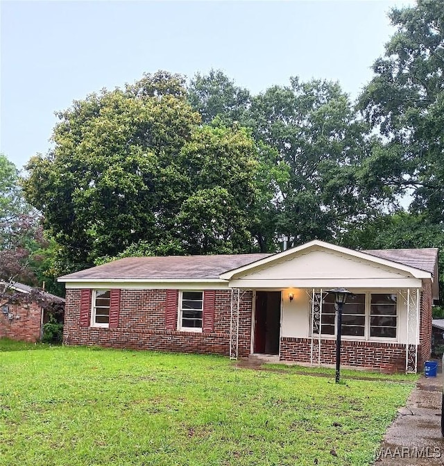 3215 Fairfax Rd, Montgomery, AL 36109 - single story home with brick siding and a front lawn