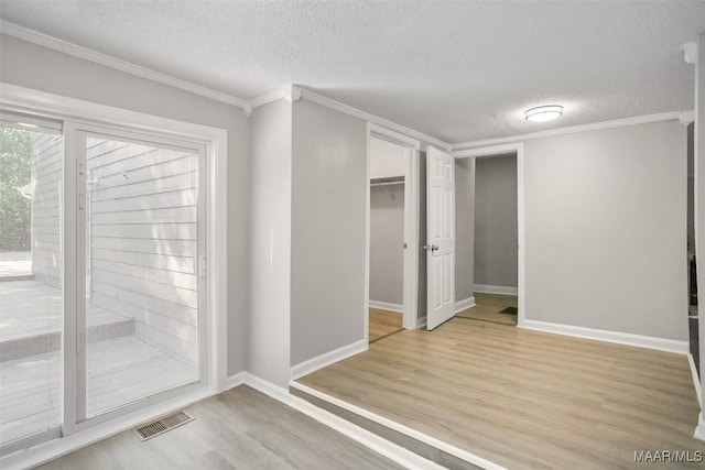 21 Judge Ests, Hope Hull, AL 36043 - unfurnished bedroom featuring light wood-type flooring, a textured ceiling, crown molding, baseboards, and access to outside