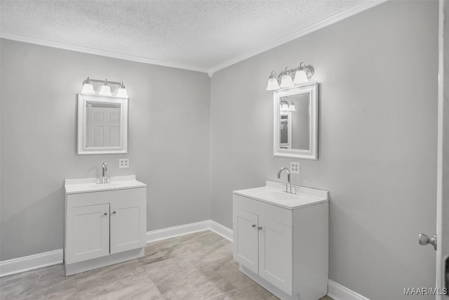 21 Judge Ests, Hope Hull, AL 36043 - bathroom with a textured ceiling, two vanities, crown molding, and baseboards