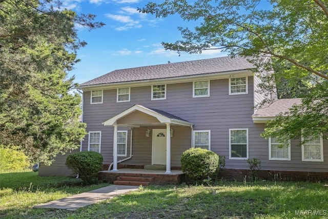 21 Judge Ests, Hope Hull, AL 36043 - colonial house with covered porch, a front yard, and roof with shingles