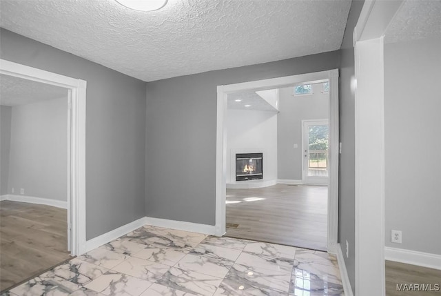 21 Judge Ests, Hope Hull, AL 36043 - corridor with baseboards, light marble finish floors, and a textured ceiling