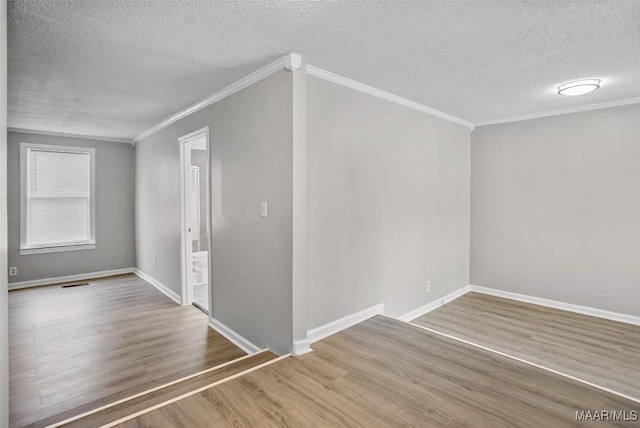 21 Judge Ests, Hope Hull, AL 36043 - unfurnished room with a textured ceiling, crown molding, wood finished floors, and baseboards