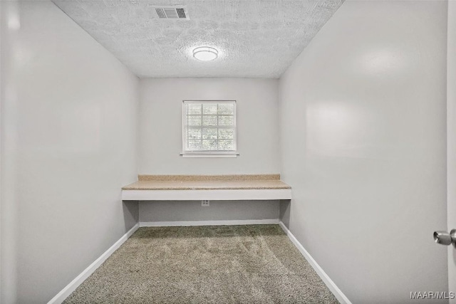 21 Judge Ests, Hope Hull, AL 36043 - carpeted empty room featuring a textured ceiling and baseboards
