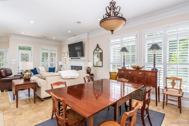 3900 Turning Leaf Loop, Montgomery, AL 36116 - dining area featuring healthy amount of natural light, a fireplace, crown molding, and recessed lighting