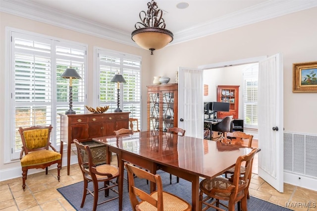 3900 Turning Leaf Loop, Montgomery, AL 36116 - dining area with crown molding, french doors, baseboards, and light stone finish flooring