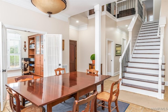 3900 Turning Leaf Loop, Montgomery, AL 36116 - dining space with ornate columns, ornamental molding, stairway, and a high ceiling