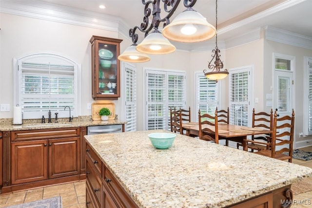 3900 Turning Leaf Loop, Montgomery, AL 36116 - kitchen featuring light stone counters, a kitchen island, ornamental molding, and recessed lighting