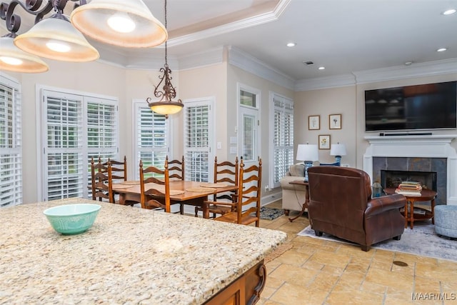 3900 Turning Leaf Loop, Montgomery, AL 36116 - dining room featuring crown molding, a tile fireplace, recessed lighting, and stone tile floors