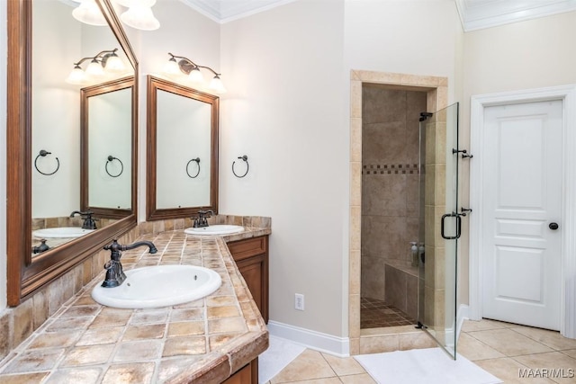 3900 Turning Leaf Loop, Montgomery, AL 36116 - full bathroom featuring a stall shower, ornamental molding, double vanity, tile patterned floors, and baseboards