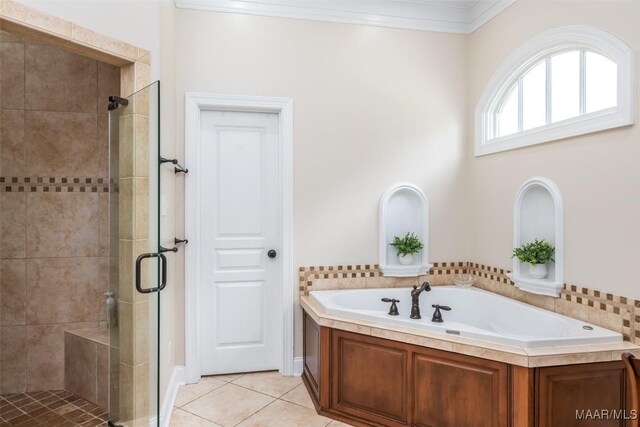 3900 Turning Leaf Loop, Montgomery, AL 36116 - full bath with a shower stall, a bath, crown molding, and tile patterned floors