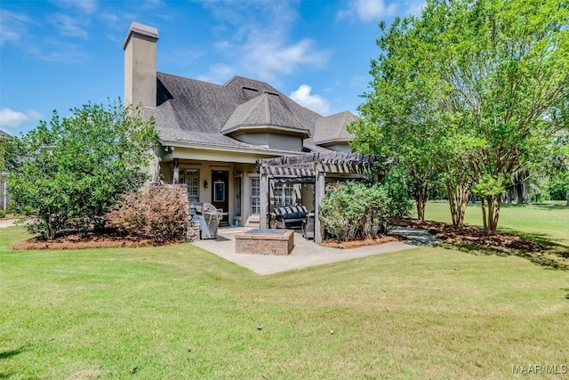 3900 Turning Leaf Loop, Montgomery, AL 36116 - rear view of property with a patio area, a fire pit, a pergola, a yard, and a chimney