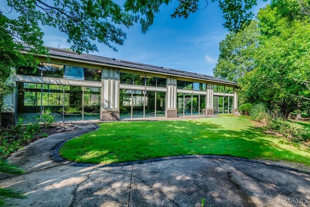 3900 Turning Leaf Loop, Montgomery, AL 36116 - rear view of house with a lawn and a patio area