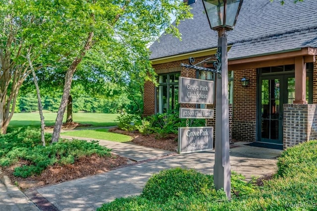 3900 Turning Leaf Loop, Montgomery, AL 36116 - doorway to property with brick siding and a shingled roof
