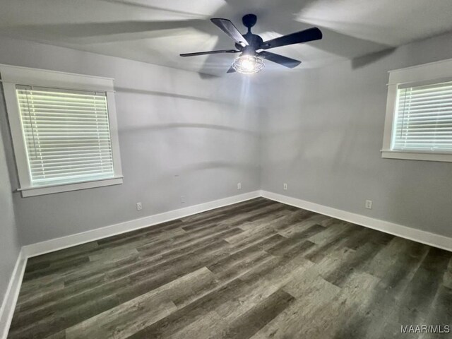504 N Charles St, Opp, AL 36467 - spare room with dark wood-style flooring, baseboards, and a ceiling fan