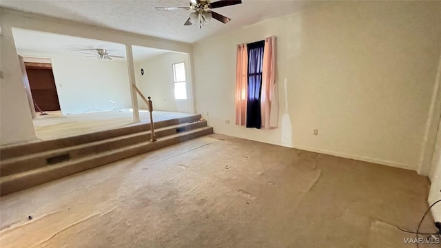 610 Booth Rd, Montgomery, AL 36108 - spare room featuring ceiling fan and stairs