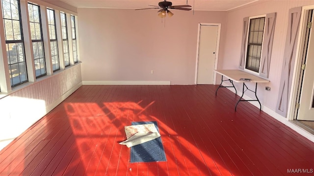 610 Booth Rd, Montgomery, AL 36108 - unfurnished living room featuring ceiling fan, wood-type flooring, crown molding, and baseboards