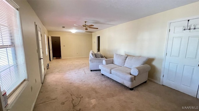 610 Booth Rd, Montgomery, AL 36108 - living area featuring light colored carpet, a ceiling fan, and baseboards