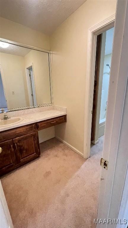610 Booth Rd, Montgomery, AL 36108 - bathroom featuring vanity, baseboards, and a textured ceiling