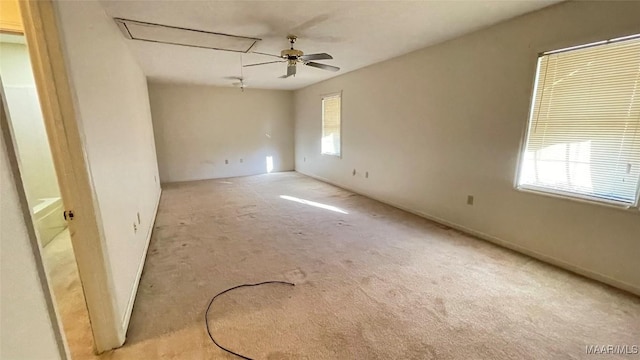 610 Booth Rd, Montgomery, AL 36108 - unfurnished room featuring attic access, light carpet, a ceiling fan, and baseboards