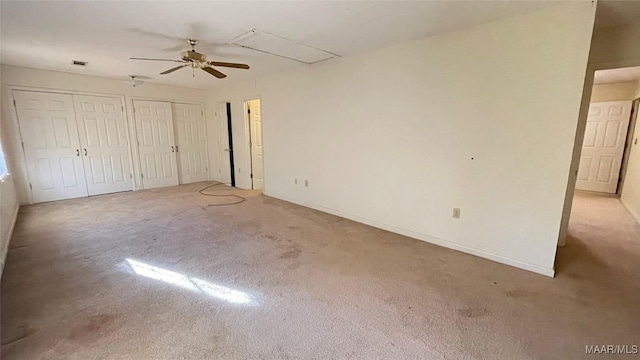 610 Booth Rd, Montgomery, AL 36108 - unfurnished bedroom featuring two closets, light carpet, attic access, ceiling fan, and baseboards