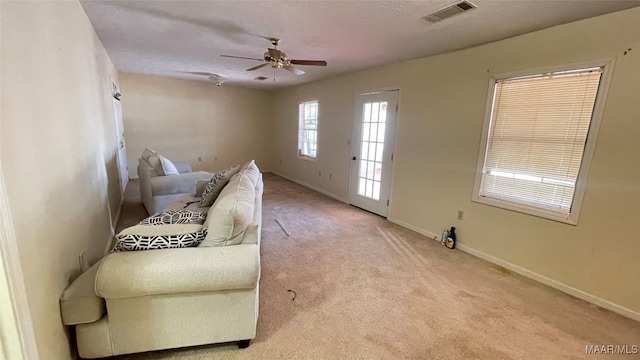 610 Booth Rd, Montgomery, AL 36108 - sitting room with a ceiling fan, carpet flooring, baseboards, and a textured ceiling