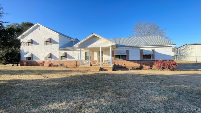 610 Booth Rd, Montgomery, AL 36108 - view of front of property with a porch, a front lawn, and metal roof