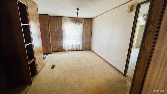 610 Booth Rd, Montgomery, AL 36108 - unfurnished dining area with carpet flooring, wood walls, and baseboards