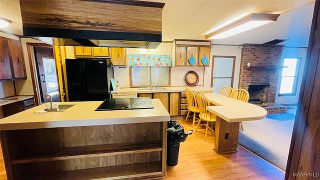 610 Booth Rd, Montgomery, AL 36108 - kitchen featuring black appliances, a sink, light countertops, and light wood-type flooring