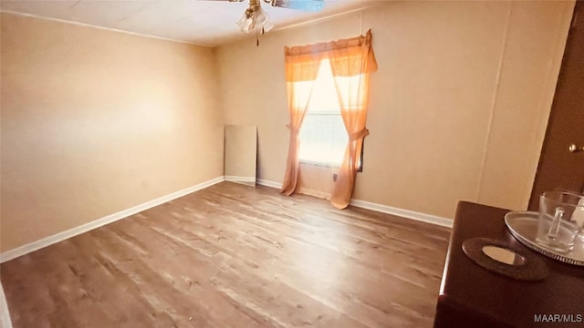610 Booth Rd, Montgomery, AL 36108 - spare room featuring wood finished floors, a ceiling fan, and baseboards