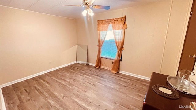 610 Booth Rd, Montgomery, AL 36108 - spare room with wood finished floors, ceiling fan, and baseboards