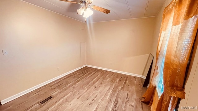 610 Booth Rd, Montgomery, AL 36108 - empty room with wood finished floors, ceiling fan, and baseboards
