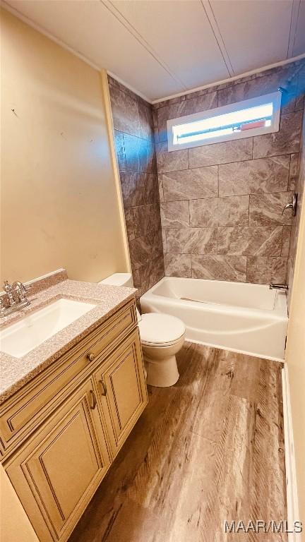 610 Booth Rd, Montgomery, AL 36108 - full bath featuring plenty of natural light, toilet, vanity, and washtub / shower combination