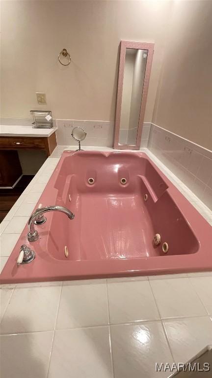 610 Booth Rd, Montgomery, AL 36108 - bathroom featuring a jetted tub and tile patterned flooring
