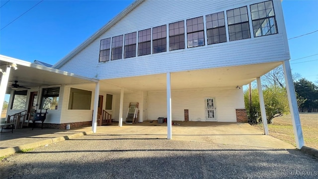 610 Booth Rd, Montgomery, AL 36108 - rear view of house with a ceiling fan, entry steps, and driveway