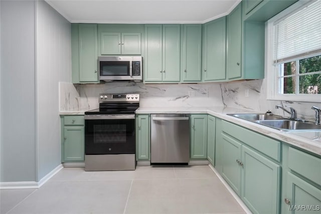 5736 Roxboro Dr, Montgomery, AL 36117 - kitchen featuring green cabinetry and appliances with stainless steel finishes