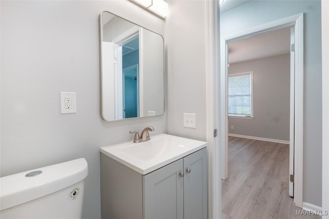5736 Roxboro Dr, Montgomery, AL 36117 - bathroom featuring wood finished floors, vanity, toilet, and baseboards