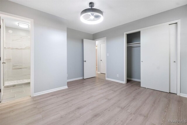 5736 Roxboro Dr, Montgomery, AL 36117 - unfurnished bedroom featuring wood finished floors, baseboards, connected bathroom, and a closet