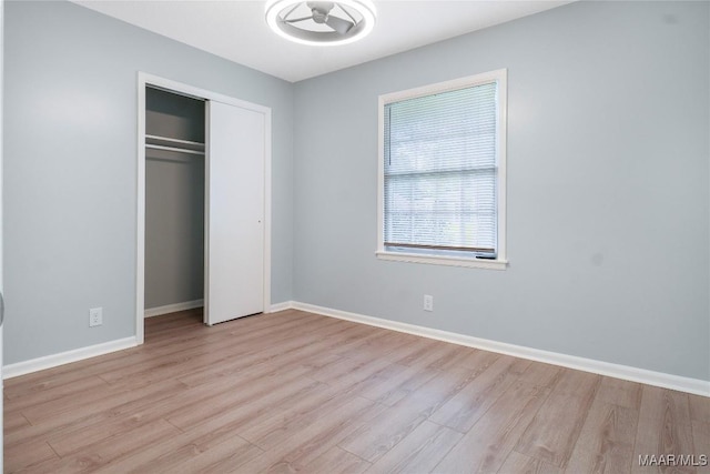 5736 Roxboro Dr, Montgomery, AL 36117 - unfurnished bedroom with wood finished floors, baseboards, and a closet