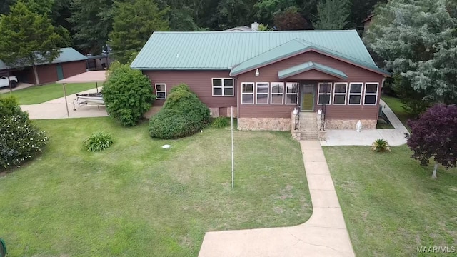 813 Lake Region Cir, Wetumpka, AL 36092 - rear view of property featuring a lawn, a patio, and metal roof
