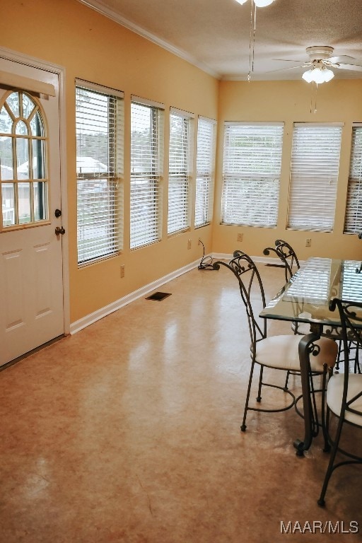 813 Lake Region Cir, Wetumpka, AL 36092 - dining room with a ceiling fan, crown molding, and baseboards
