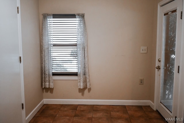 813 Lake Region Cir, Wetumpka, AL 36092 - empty room with dark tile patterned floors and baseboards