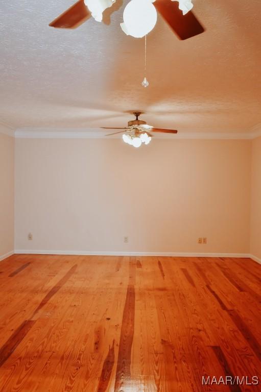 813 Lake Region Cir, Wetumpka, AL 36092 - unfurnished room featuring crown molding, ceiling fan, wood finished floors, and a textured ceiling