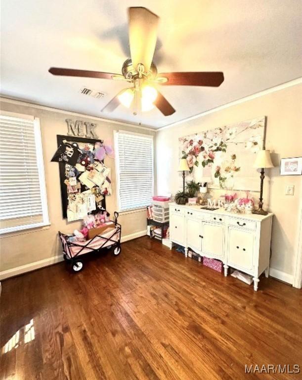 1915 Mckinley Ave, Montgomery, AL 36107 - rec room with ornamental molding, a ceiling fan, baseboards, and dark wood-style floors