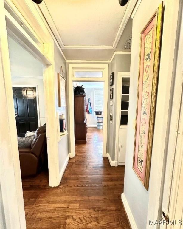 1915 Mckinley Ave, Montgomery, AL 36107 - hall with dark wood-type flooring, baseboards, and ornamental molding