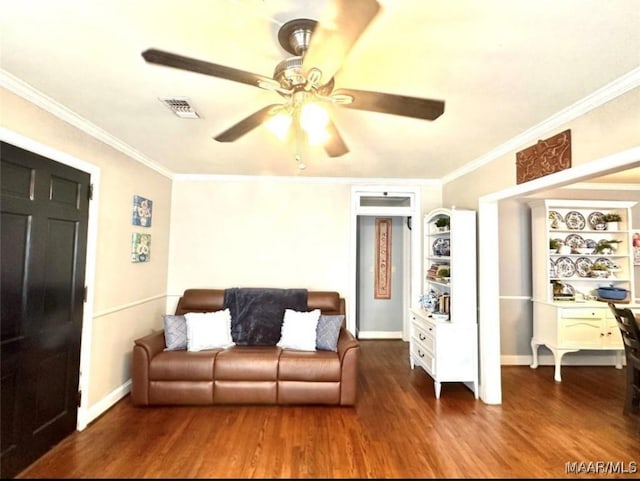 1915 Mckinley Ave, Montgomery, AL 36107 - living area featuring a ceiling fan, ornamental molding, wood finished floors, and baseboards