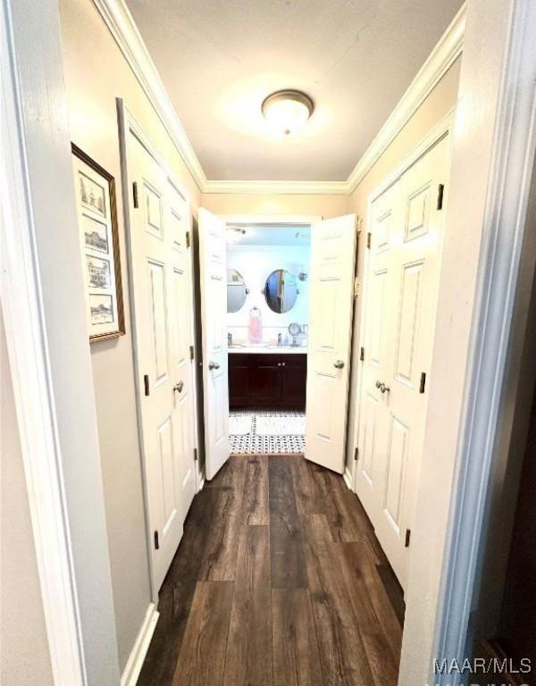 1915 Mckinley Ave, Montgomery, AL 36107 - hallway with dark wood-style floors and crown molding
