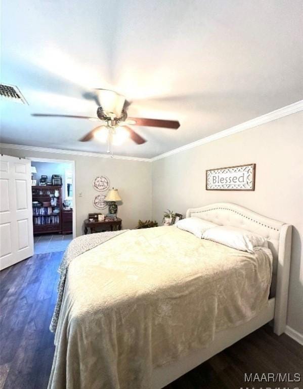 1915 Mckinley Ave, Montgomery, AL 36107 - bedroom with crown molding, dark wood-style floors, ceiling fan, and baseboards